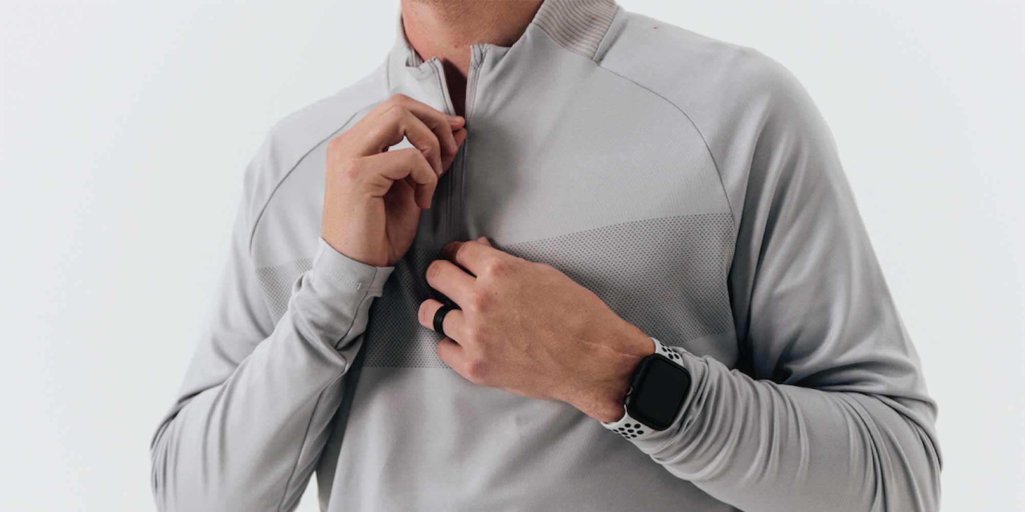 Man zipping up stylish gray mens 1/4 zip pullover 