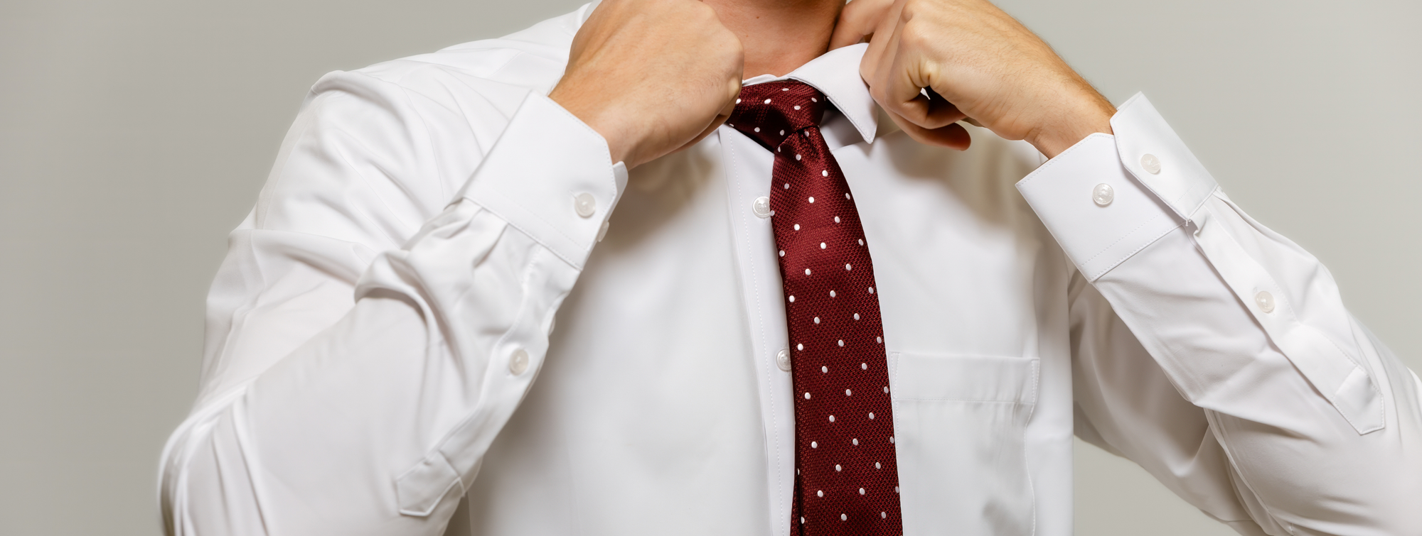 Truwear Professional Work Wear white dress shirt and tie being worn by a man.